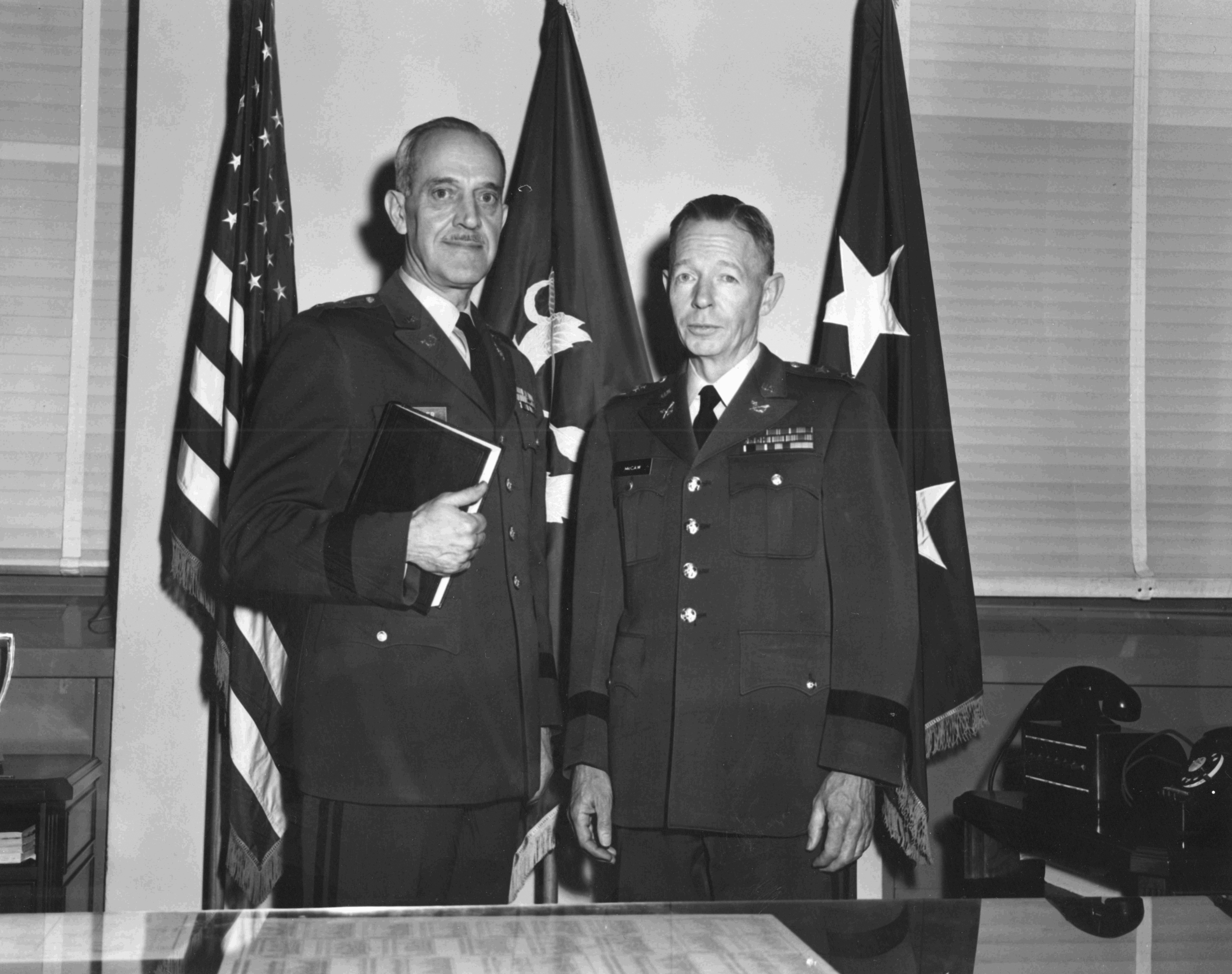 Major General Robert H. McCaw (right), TAJAG,
        1961–1964, and Major General Charles Decker,
        TJAG. (Photo courtesy of Fred L. Borch III)